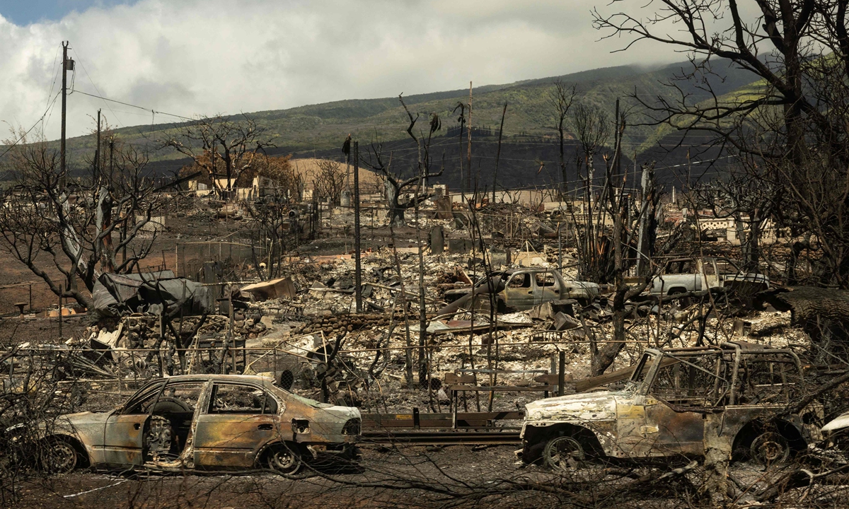 Carcasses of cars can be seen among the ashes of burnt neighborhood in the aftermath of a wildfire, is seen in Lahaina, western Maui, Hawaii on August 14, 2023. Photo: VCG