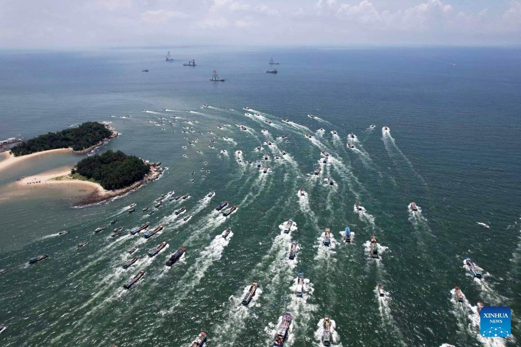 This aerial photo taken on Aug. 16, 2023 shows fishing boats sailing off from the Dianjian fishing port in Beihai City, south China's Guangxi Zhuang Autonomous Region. The fishing season of the South China Sea started Wednesday after this summer's three-and-half-month fishing ban.(Photo: Xinhua)