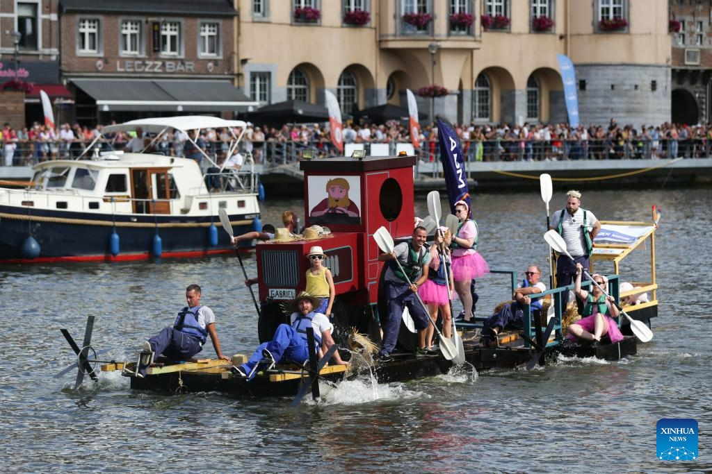 Participants take part in the International Bathtub Regatta on the Meuse River in Dinant, Belgium, on Aug. 15, 2023. Starting in 1982, participants vie to create the most impressive bathtub-based craft and compete down the Meuse River in Dinant on Aug. 15 each year.(Photo: Xinhua)