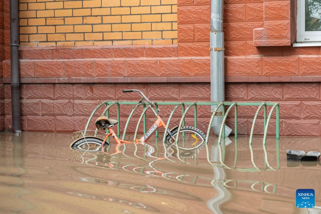 This photo taken on Aug. 15, 2023 shows a bike soaked in flood water in Ussuriysk, Russia. Typhoon Khanun triggered severe floods in Primorsky Krai of Russia's Far East, prompting 21 municipalities to declare a state of emergency, the Russian Ministry of Emergency Situations said on Sunday. The typhoon brought heavy rainfall to Primorsky Krai from Aug. 9 to 11.(Photo: Xinhua)