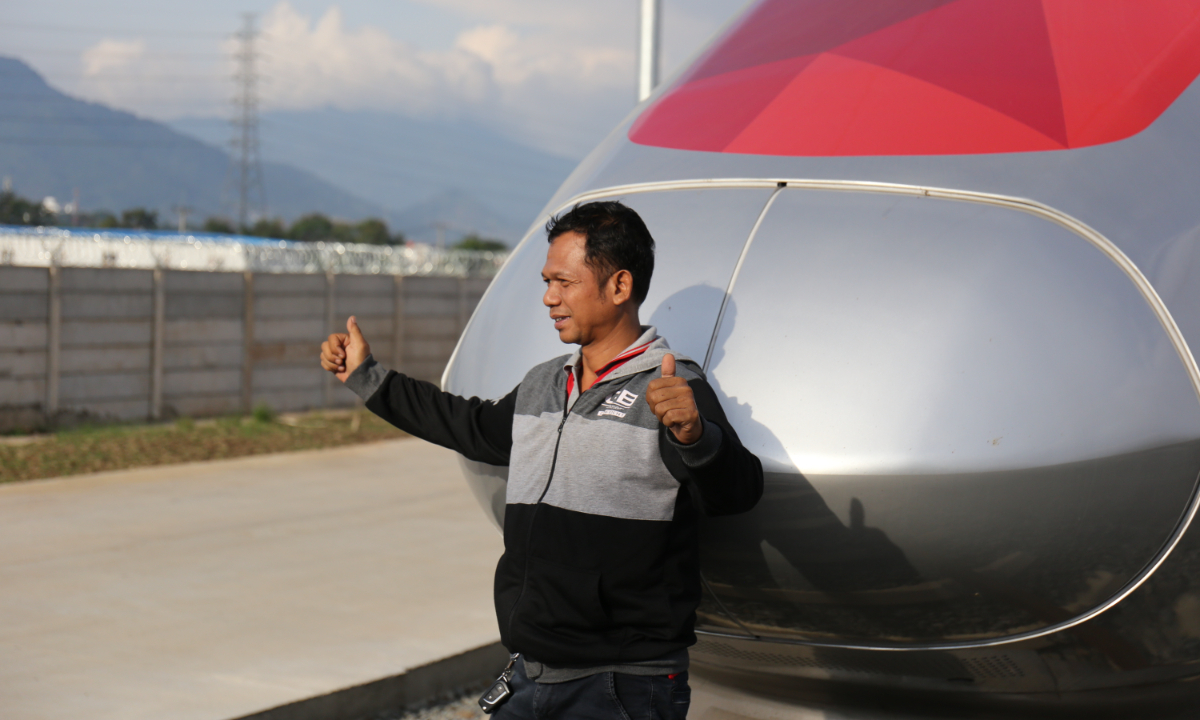 A local poses for a photo in front of the Jakarta-Bandung High-Speed Railway train in Bandung, Indonesia. Photo: Zhao Juecheng/GT