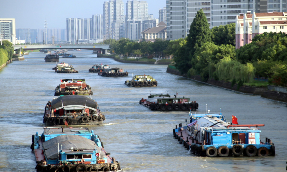 Barges transport cargoes along the Grand Canal in Suzhou, East China’s Jiangsu Province on August 21, 2023. In the first half of 2023, Jiangsu invested 12.78 billion yuan ($1.76 billion) into ports and waterways, up 7.1 percent from the same period in 2022. 