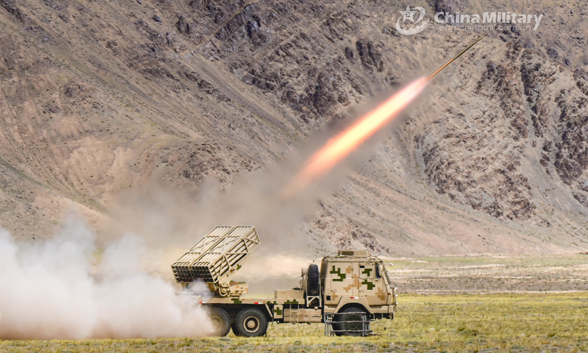 A truck-mounted multiple launch rocket system attached to an artillery regiment under the PLA Xinjiang Military Command fires at mock targets during a field live-fire training exercise on August 19, 2023. Photo: China Military