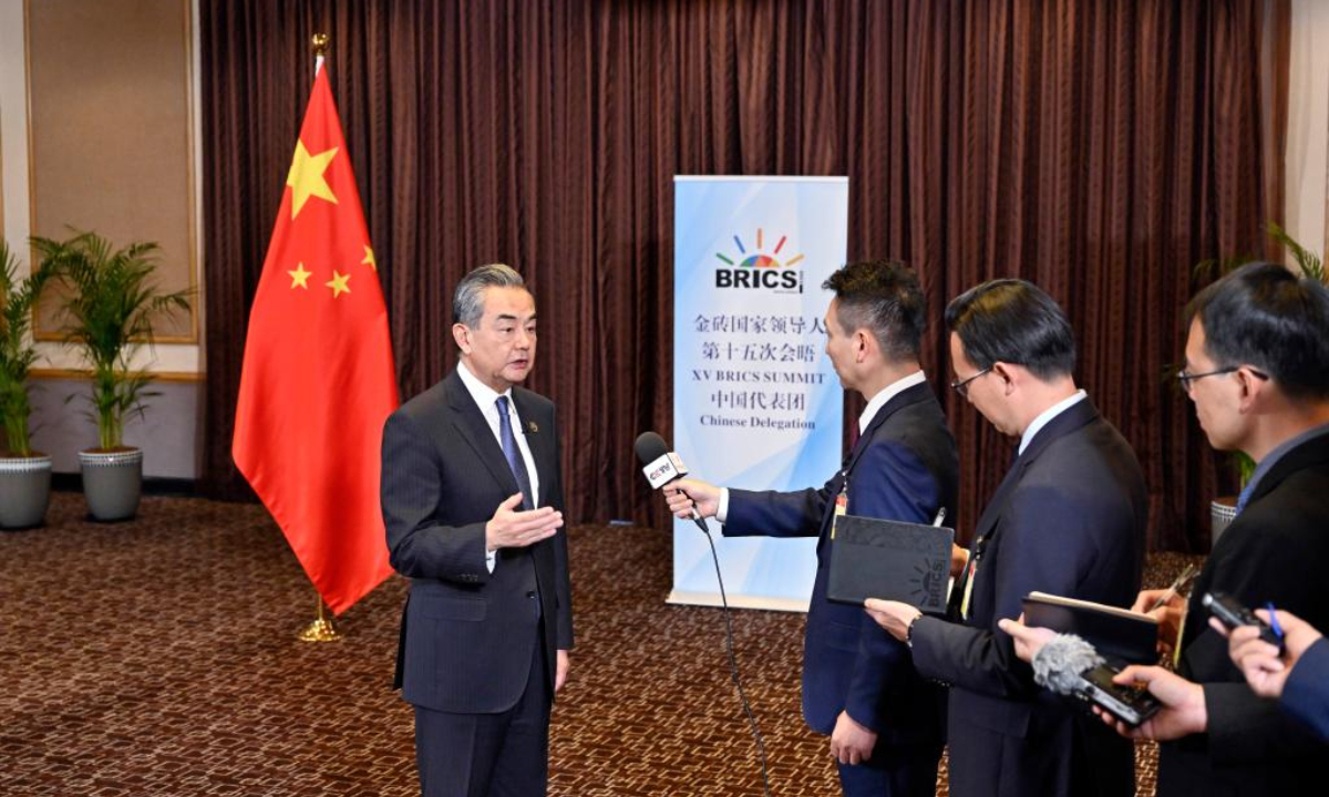 Wang Yi, member of the Political Bureau of the Communist Party of China Central Committee and foreign minister, briefs the media on Chinese President Xi Jinping's South Africa trip. Photo:Xinhua
