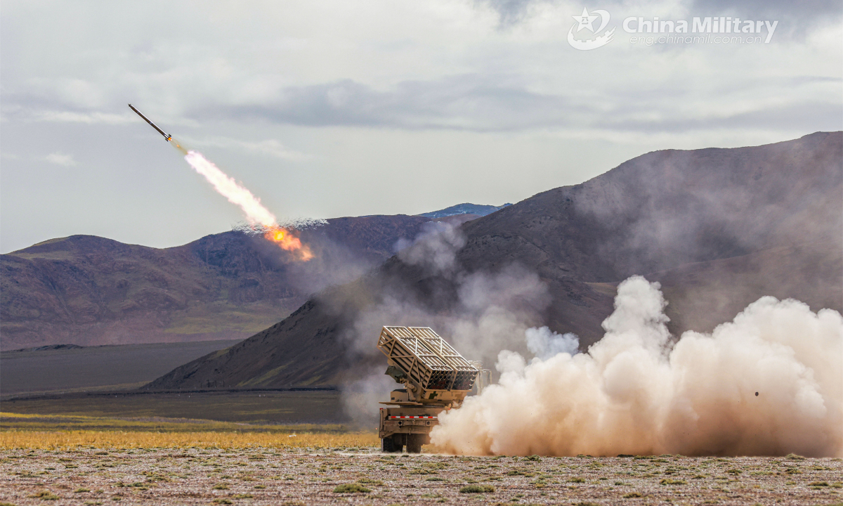 A truck-mounted multiple launch rocket system attached to an artillery regiment under the PLA Xinjiang Military Command fires at mock targets during a field live-fire training exercise on August 19, 2023. Photo: China Military