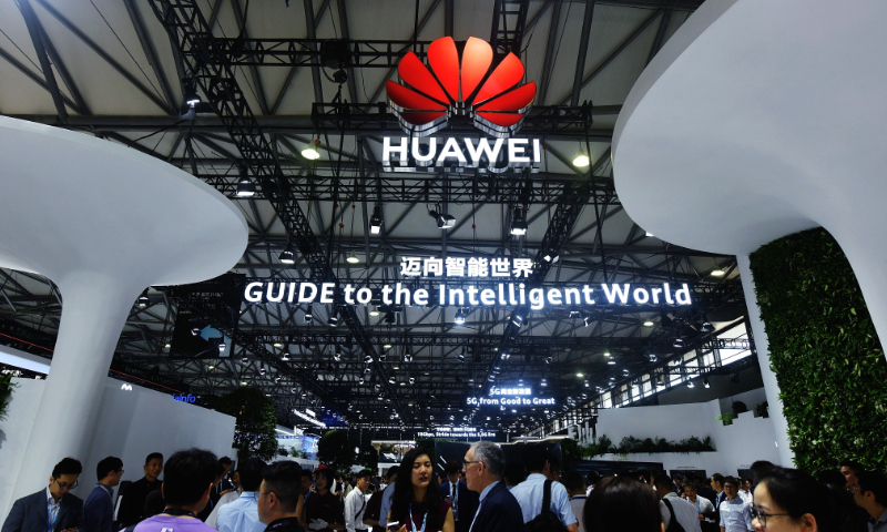 Attendees visit the Huawei booth at the 2023 World Mobile Congress on June 28, 2023, in Shanghai. Photo: VCG