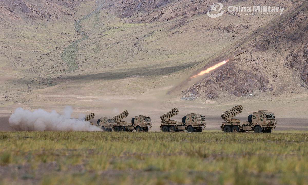 Truck-mounted multiple launch rocket systems attached to an artillery regiment under the PLA Xinjiang Military Command fire at mock targets during a field live-fire training exercise on August 19, 2023. Photo: China Military