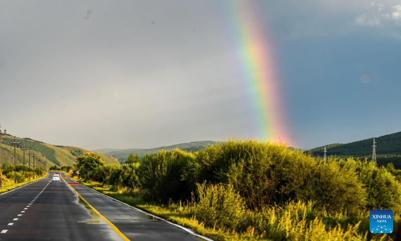 This photo taken on Aug. 31, 2023 shows the scenery of a rainbow in Arxan of Hinggan League, north China's Inner Mongolia Autonomous Region. Arxan, located at the southwestern foot of the Dahinggan Mountains and at the intersection of four major grasslands, is an increasingly popular tourist destination. (Xinhua/Lian Zhen)