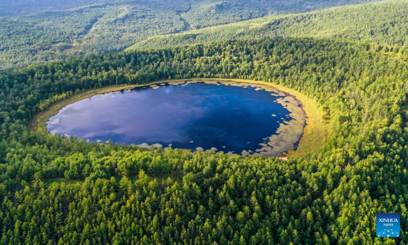 This aerial photo taken on Aug. 31, 2023 shows the scenery of Tianchi (Heavenly Lake) in Arxan of Hinggan League, north China's Inner Mongolia Autonomous Region. Arxan, located at the southwestern foot of the Dahinggan Mountains and at the intersection of four major grasslands, is an increasingly popular tourist destination. (Xinhua/Lian Zhen)