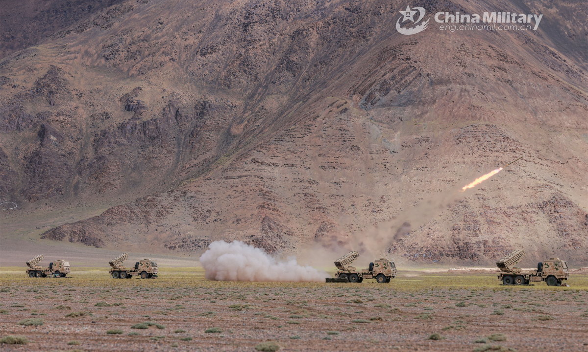 Truck-mounted multiple launch rocket systems attached to an artillery regiment under the PLA Xinjiang Military Command fire at mock targets during a field live-fire training exercise on August 19, 2023. Photo: China Military