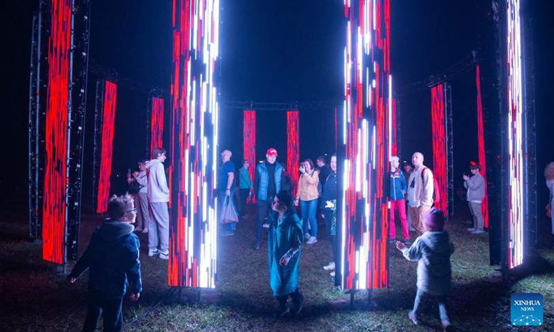 People visit a light show at the Gatchina Palace and Estate Museum near St. Petersburg, Russia, Aug. 19, 2023. The Gatchina Palace and Estate Museum hosted an international light art festival from Aug. 17 to Aug. 19, attracting multimedia professionals from various countries to demonstrate their artworks. Photo: Xinhua
