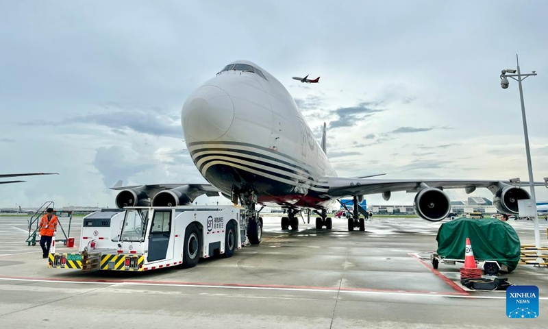 A staff member prepares a plane for SF Airlines' Shenzhen-Port Moresby cargo route at Shenzhen Baoan International Airport in Shenzhen, south China's Guangdong Province, Aug. 20, 2023. (SF Airlines/Handout via Xinhua)