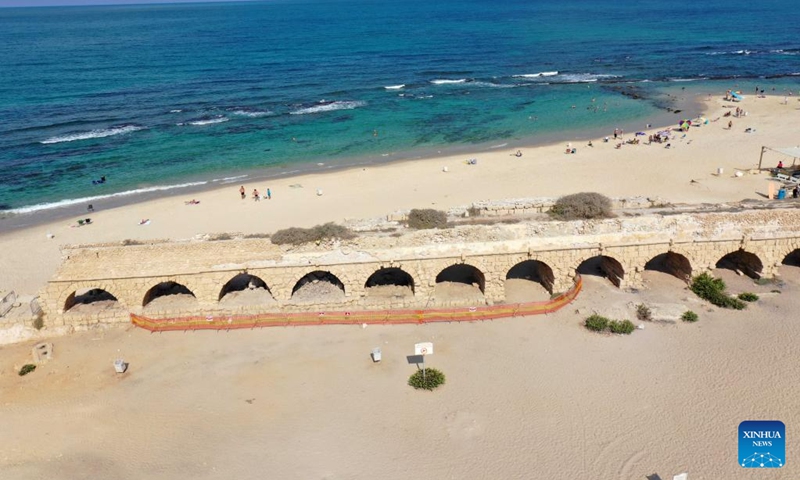 This aerial photo taken on Aug. 20, 2023 shows a view of the Roman aqueduct system on a beach in Caesarea, Israel. An ancient arch structure in Caesarea's famous ancient Roman aqueduct system collapsed on a beach early Friday morning. Israel Antiquities Authority said the section that collapsed was built in the time of Emperor Hadrian, some 1900 years ago. Photo: Xinhua