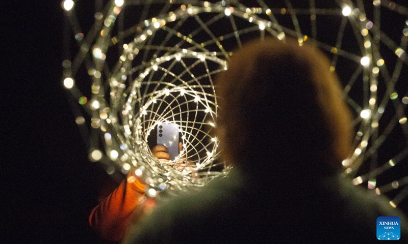 People take photos during a light show at the Gatchina Palace and Estate Museum near St. Petersburg, Russia, Aug. 19, 2023. The Gatchina Palace and Estate Museum hosted an international light art festival from Aug. 17 to Aug. 19, attracting multimedia professionals from various countries to demonstrate their artworks. Photo: Xinhua