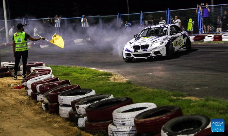 A competitor performs during the drift challenge of Misr International Motorsport Championship in New Alamein City, Egypt, Aug. 19, 2023. (Xinhua/Ahmed Gomaa)