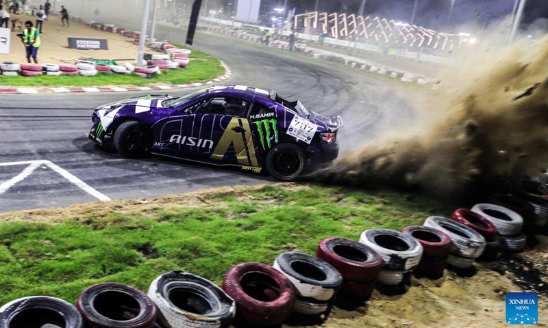 A competitor performs during the drift challenge of Misr International Motorsport Championship in New Alamein City, Egypt, Aug. 19, 2023. (Xinhua/Ahmed Gomaa)