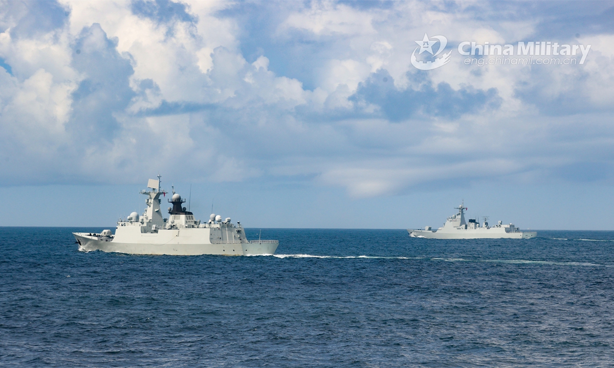 Warships attached to a destroyer flotilla with the PLA Navy sail in formation during a recent real-combat training exercise. (eng.chinamil.com.cn/Photo by Shen Yang)