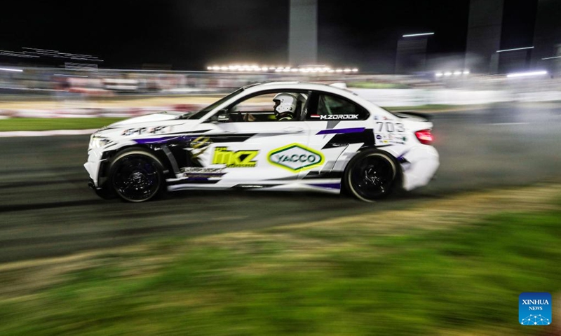 A competitor performs during the drift challenge of Misr International Motorsport Championship in New Alamein City, Egypt, Aug. 19, 2023. (Xinhua/Ahmed Gomaa)
