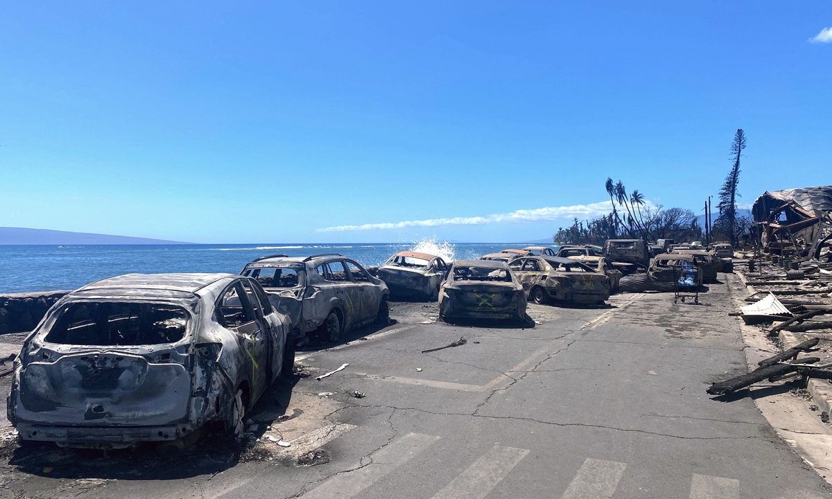 Burned cars and destroyed buildings are pictured in the aftermath of a wildfire in Lahaina, western Maui, Hawaii on August 11, 2023. Photo: VCG
