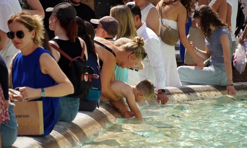 A boy cools off at the Fontana di Trevi in Rome, Italy, on Aug. 22, 2023. Italy is in the grip of its third major heatwave of this summer, as the hottest two-year period on record continues in the country.(Photo: Xinhua)