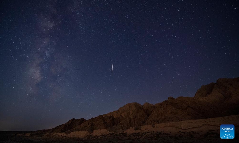 This long-time exposure photo taken on Aug. 20, 2023 shows a section of the Great Wall built in Ming dynasty (1368-1644) under the starry night sky in north China.(Photo: Xinhua)