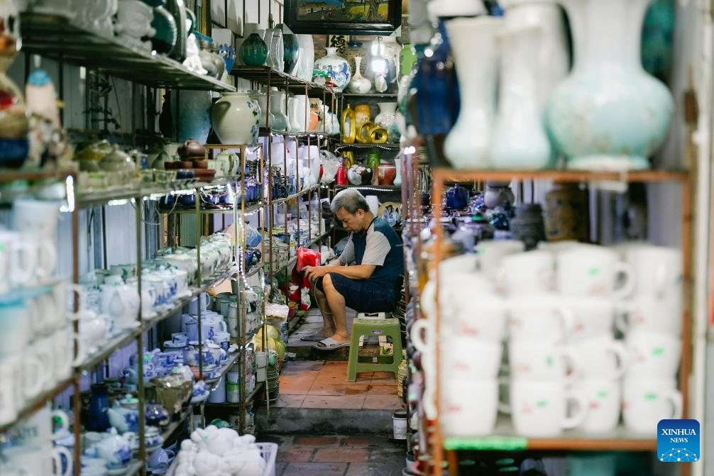 This photo taken on Aug. 19, 2023 shows a ceramic market located in Bat Trang Pottery Village, Gia Lam district, Hanoi, Vietnam. Bat Trang has a long history of porcelain and pottery making. The village's ceramic and pottery products are well known for high quality and abundant styles.(Photo: Xinhua)