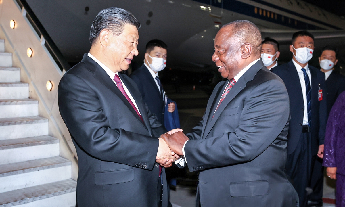 Chinese President Xi Jinping is warmly greeted by South African President Cyril Ramaphosa upon his arrival at the OR Tambo International Airport in Johannesburg, South Africa, on August 21, 2023. Xi arrived in Johannesburg on Monday to attend the 15th BRICS Summit, and to pay a state visit to South Africa. Photo: Xinhua