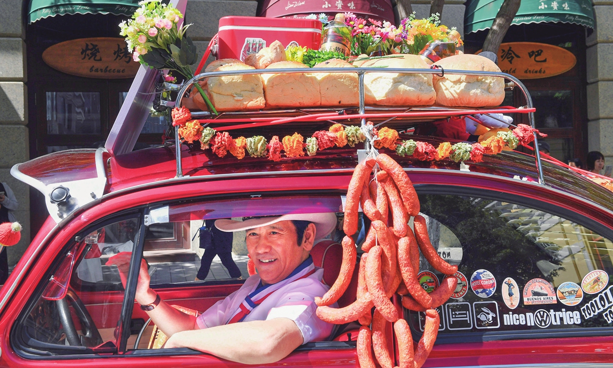 A driver participates in the food parade as the 8th China International Western Food Culture Festival kicked off in Harbin, Northeast China's Heilongjiang Province on August 24, 2023. This festival will invite chefs from countries such as France, Italy and Germany for culinary skills exchanges.Photo: VCG