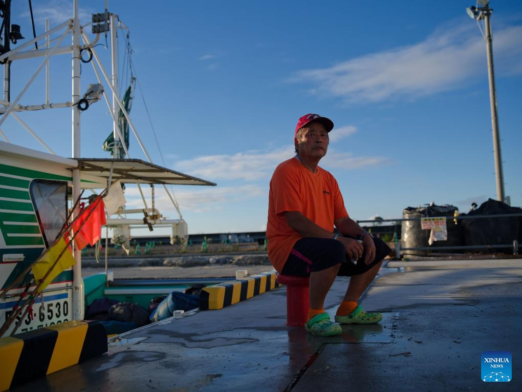 Fisherman Ono Haruo sits at Tsurishihama Fishing Port after fishing in Shinchi Town, Fukushima Prefecture, Japan, Aug. 23, 2023. Japan started releasing nuclear-contaminated wastewater from the crippled Fukushima Daiichi Nuclear Power Plant into the Pacific Ocean on Thursday, despite raging opposition from both at home and abroad.(Photo: Xinhua)