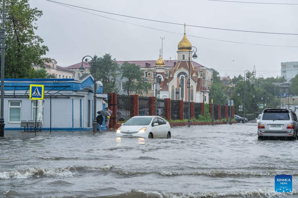 A street is flooded by rainwater in downtown Vladivostok, Russia, Aug. 23, 2023. The city experienced torrential rain on Wednesday, causing flooding in low-lying areas of the urban area.(Photo: Xinhua)
