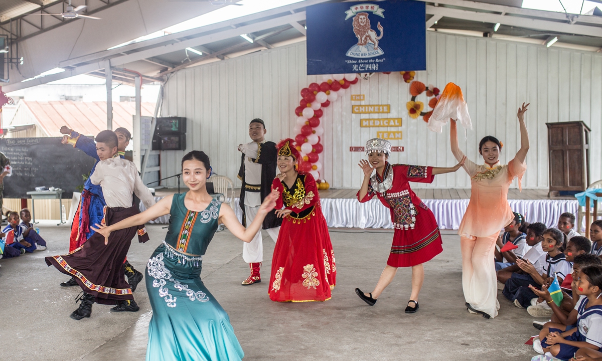 A squad of officers from the <em>Ark Peace</em> perform a Chinese dance at Honiara's <em>Chung Wah</em> School on August 22, 2023 Photo: Shan Jie/GT
