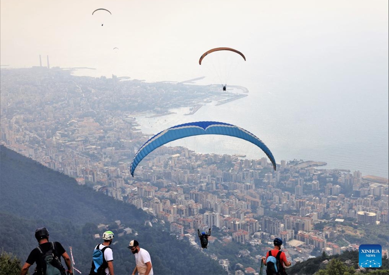 People paraglide over the city of Jounieh, Lebanon, on Aug. 26, 2023. Photo: Xinhua