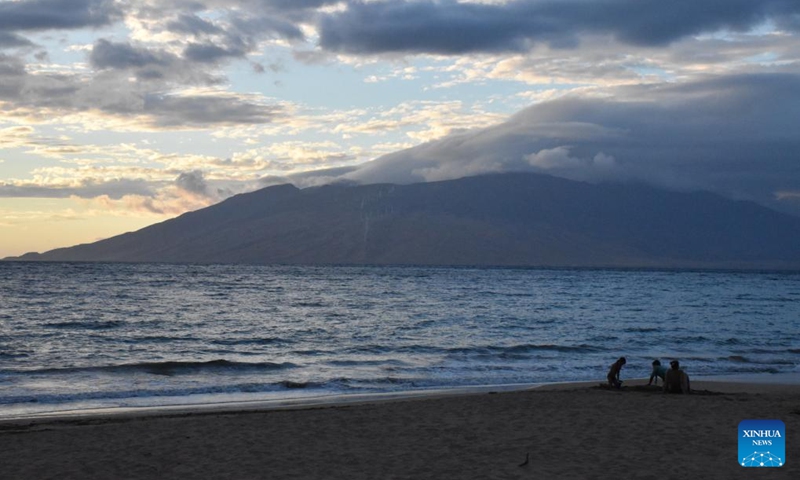 Photo taken on Aug. 21, 2023 shows people spending time on an empty beach in Maui, Hawaii, the United States. The devastating wildfires that ravaged the Hawaiian island of Maui were a bitter blow to the island's tourism industry, but local residents and business leaders expect more tourists will come back as the island embarks on a long road ahead for recovery. Photo: Xinhua