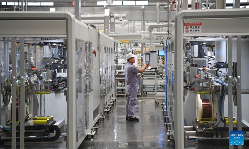 A worker works at a motor stator and rotor workshop of a company in the Western Science City in southwest China's Chongqing Municipality, Aug. 24, 2023. In recent years, Chongqing's Western Science City has vigorously implemented the intelligent manufacturing cultivation project, guiding enterprises to accelerate the intelligent transformation and digital transformation and upgrading, and helping local industries to improve quality and efficiency. (Xinhua/Wang Quanchao)