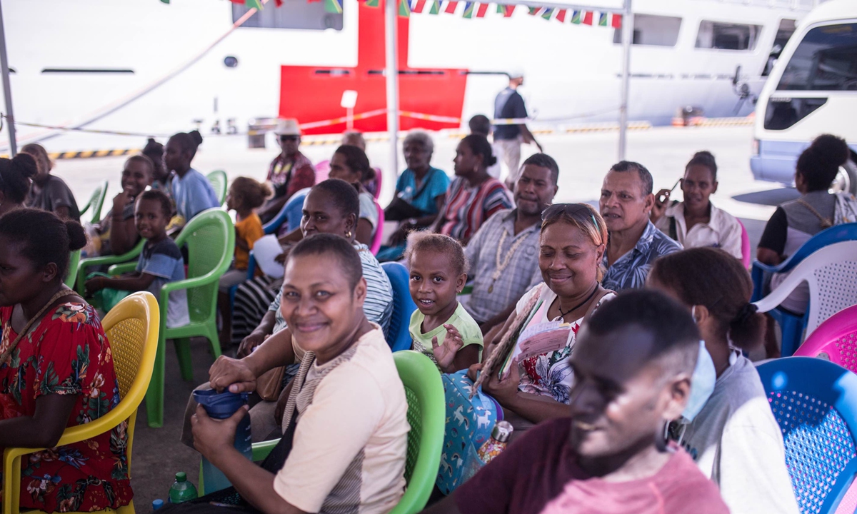 People wait to get onboard of the <em>Ark Peace</em> at Honiara port on August 20, 2023. Photo: Shan Jie/GT