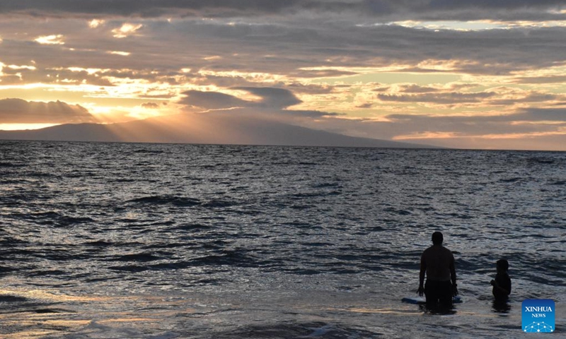 Photo taken on Aug. 21, 2023 shows people swimming in the sea in Maui, Hawaii, the United States. The devastating wildfires that ravaged the Hawaiian island of Maui were a bitter blow to the island's tourism industry, but local residents and business leaders expect more tourists will come back as the island embarks on a long road ahead for recovery. Photo: Xinhua