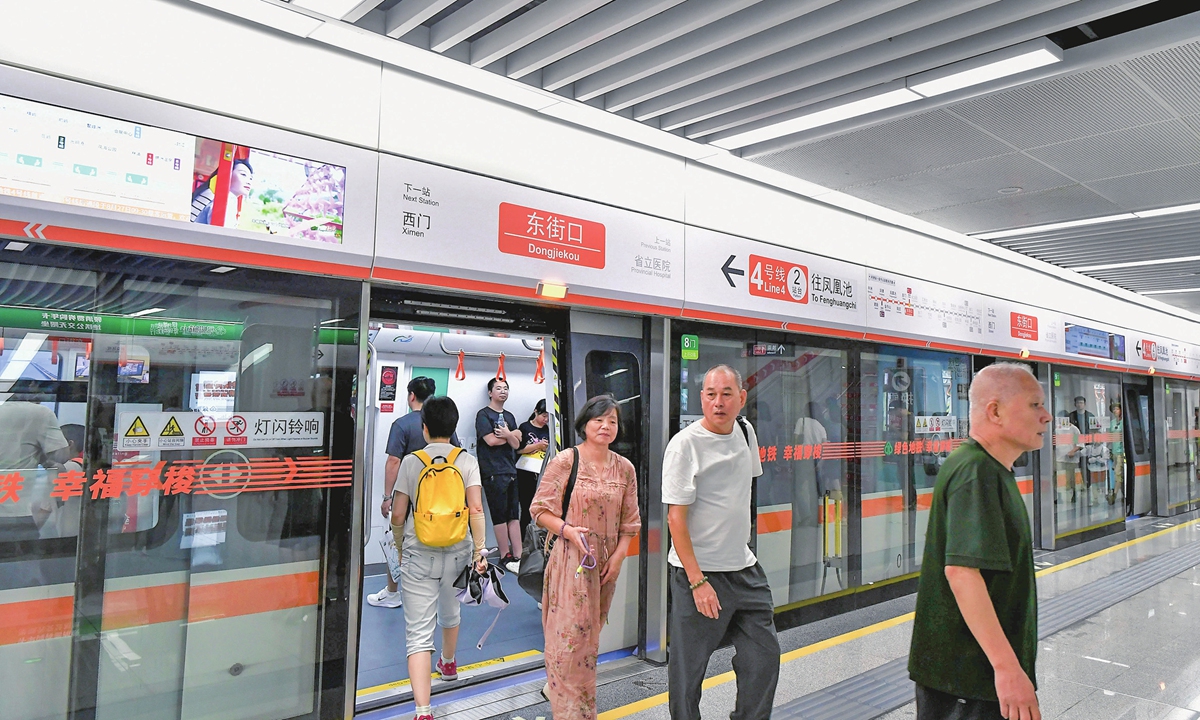 Passengers get off the No.4 Subway Line in Fuzhou, capital city of East China's Fujian Province on August 27, 2023. The newly launched metro line is the province's first fully automated subway. The line deploys the world's most advanced or 