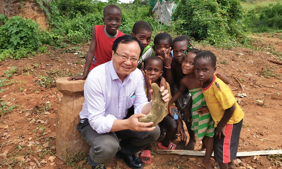 A Chinese expert poses for a photo with children in Madagascar. Photo: Courtesy of Sino-Africa Joint Research Center, Chinese Academy of Sciences