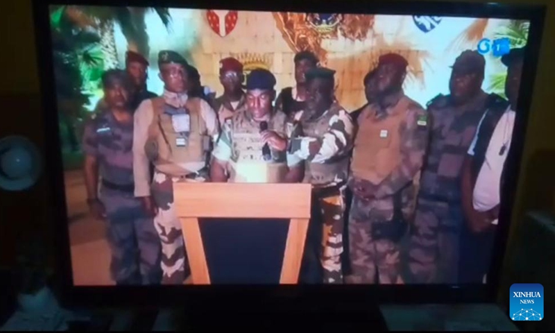 This video grab shows a group of Gabonese military officers releasing a statement via a TV channel in the early morning of Aug. 30, 2023. Gabonese military officers have canceled election results and dissolved state institutions, claiming they have taken power, local media reported on Wednesday.(Xinhua)