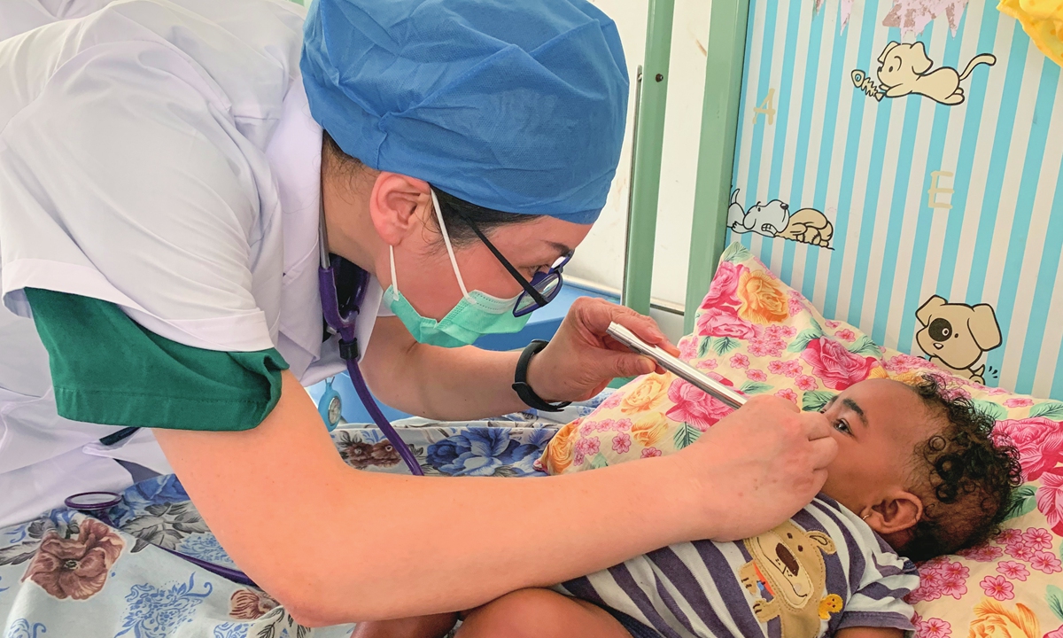 A Chinese doctor examines a local child in Pemba Island in September, 2020. Photo: Courtesy of Liu Xin 