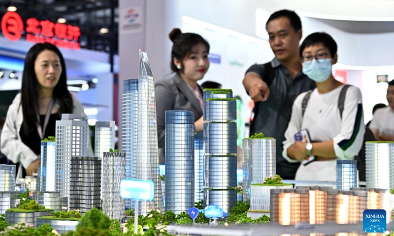 Visitors look at a sandbox model of smart city solution at the environmental services exhibition of the 2023 China International Fair for Trade in Services (CIFTIS) in Beijing, capital of China, Sept. 2, 2023. Themed Opening-up leads development, cooperation delivers the future, the 2023 CIFTIS is being held in Beijing from Sept. 2 to 6 and features over 200 varied events, including forums, negotiations, and summits.  (Photo: Xinhua)