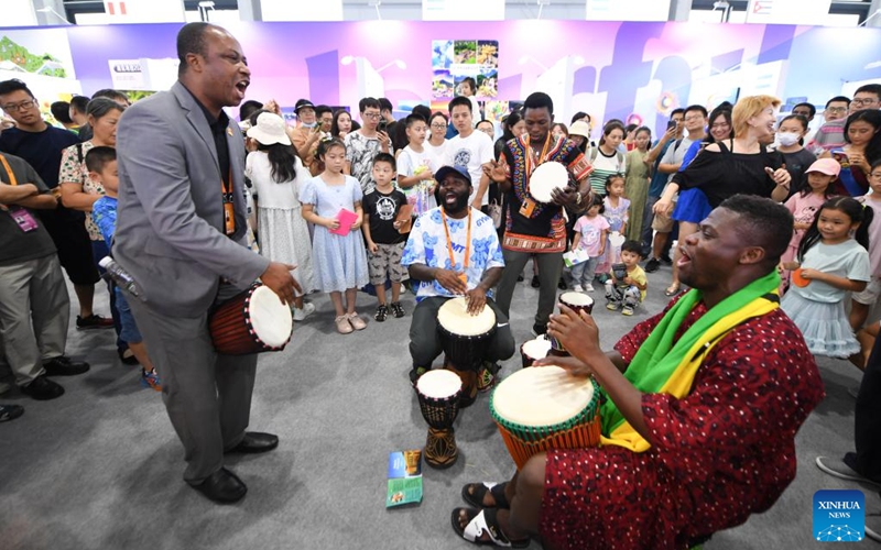 Staff members perform at an exhibition booth of the Ghanaian embassy in China at the 8th Colourful World -- Cultural Exhibition of Countries along the Belt and Road during the 2023 China International Fair for Trade in Services (CIFTIS) in Beijing, capital of China, Sept. 2, 2023. Photo: Xinhua