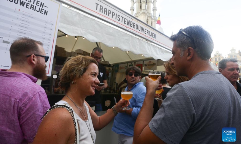 People enjoy beers at the 23rd Belgian Beer Weekend in Brussels, Belgium, Sept. 2, 2023. More than 500 Belgian beers were presented by 53 breweries to the public during the event. Photo: Xinhua