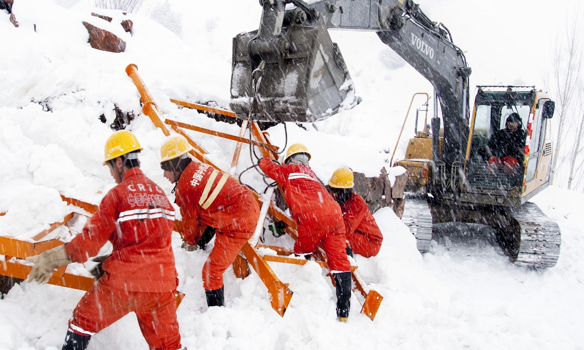 Workers rush to build a gravel processing plant during a snowstorm.Photo: Courtesy of CRTG