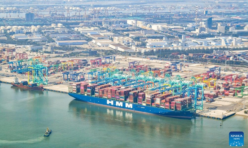 This aerial view taken on June 16, 2023 shows a container ship berthing at the Tianjin Port in north China's Tianjin Municipality.Photo:Xinhua