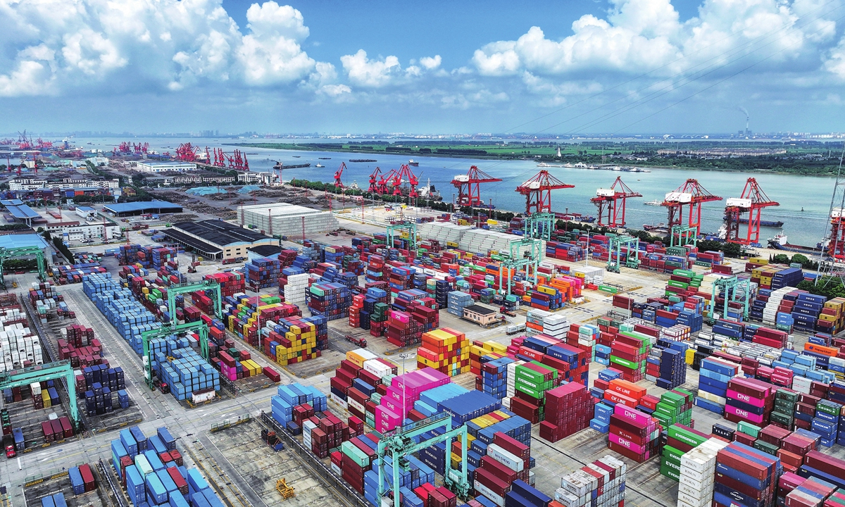 Vehicles and ships busily load and unload shipments in the Zhangjiagang Port, East China's Jiangsu Province on September 6, 2023. Ports in Jiangsu completed cargo throughput of 1.94 billion tons, trade throughput of 350 million tons and container throughput of 14.19 million standard containers in the first seven months of 2023. Photo: cnsphoto