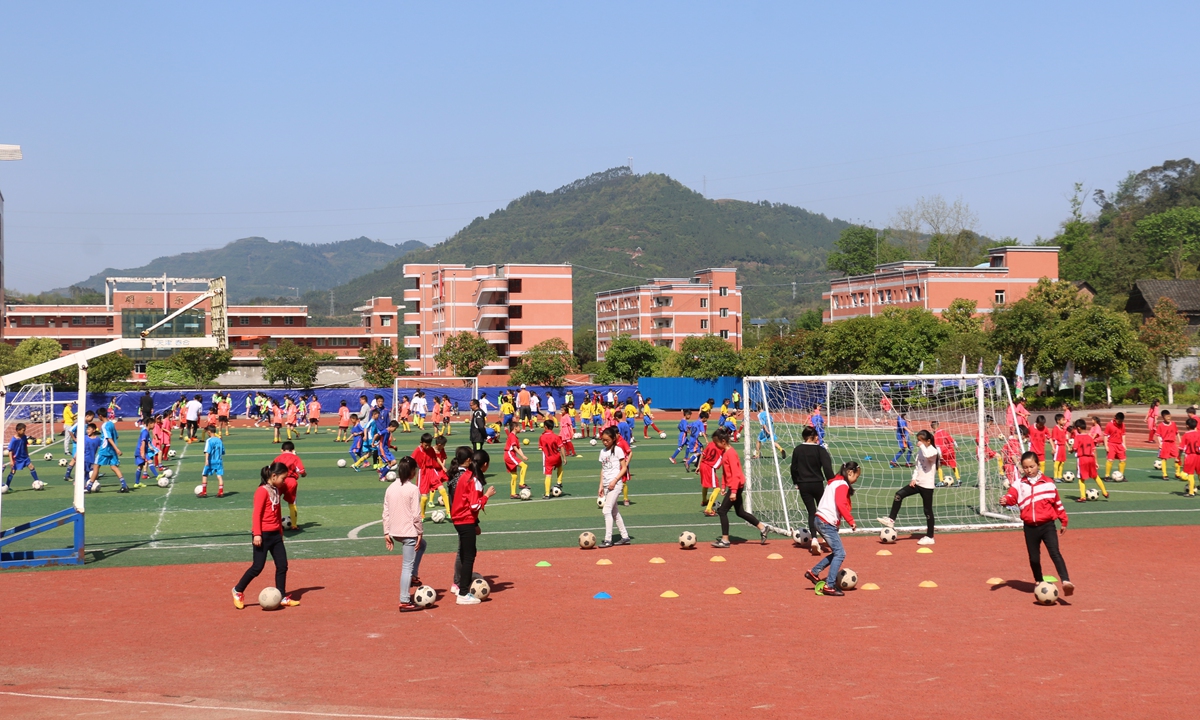 Children play soccer at the Sanhe town primary school in Chongqing. Photo: Courtesy of Ma Jianwei