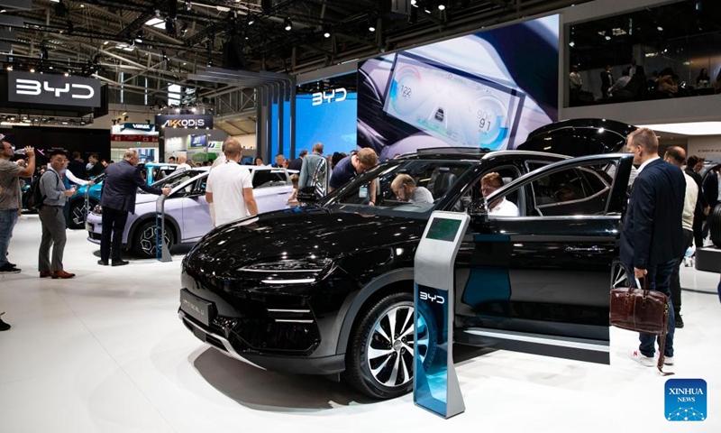People visit the booth of Chinese carmaker BYD during the 2023 International Motor Show, officially known as the IAA MOBILITY 2023, in Munich, Germany, Sept. 5, 2023. The IAA MOBILITY 2023, one of the world's largest mobility trade fairs, opened in the southern German city of Munich on Tuesday.(Photo: Xinhua)