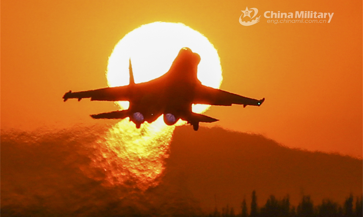 A fighter jet attached to the PLA Air Force Xi'an Flying College takes off at sunset during an around-the-clock training mission on August 19, 2023. Photo:China Military