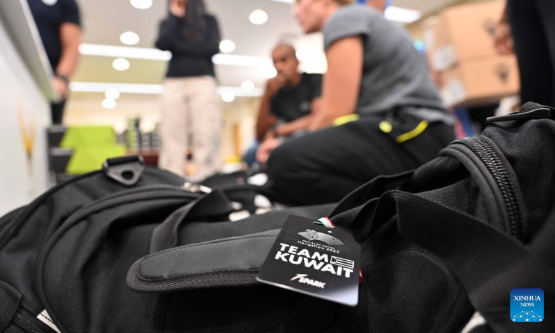 Athletes prepare their baggages for the upcoming Hangzhou Asian Games at the Kuwait Olympic Committee in Jahra Governorate, Kuwait, Sept. 10, 2023. (Photo by Asad/Xinhua)